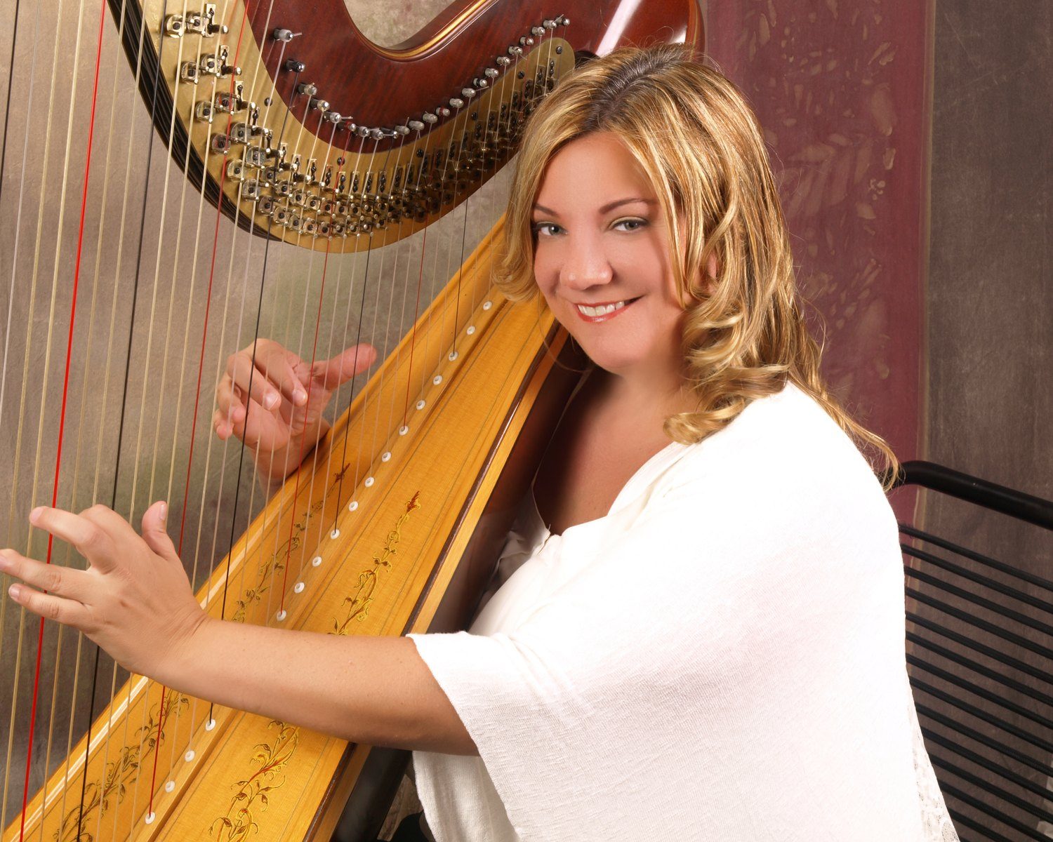 Patricia Turse playing her pedal harp