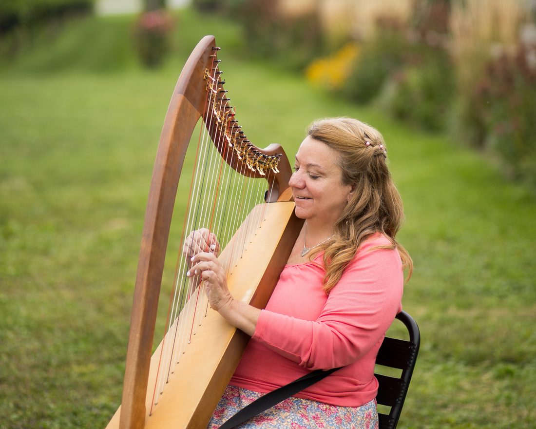 Patricia Turse playing her lap harp